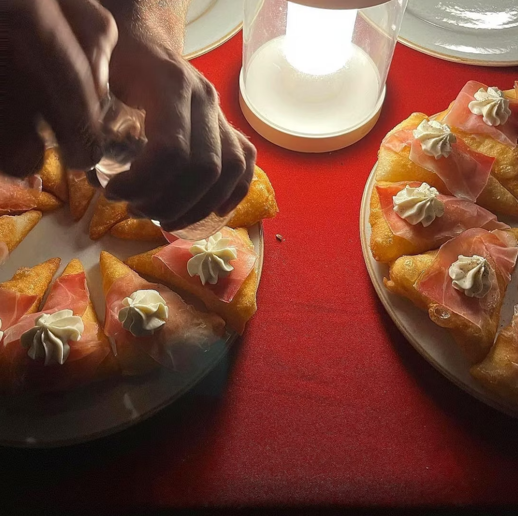 Chef Othman serving artisanal montanare at a private dinner party